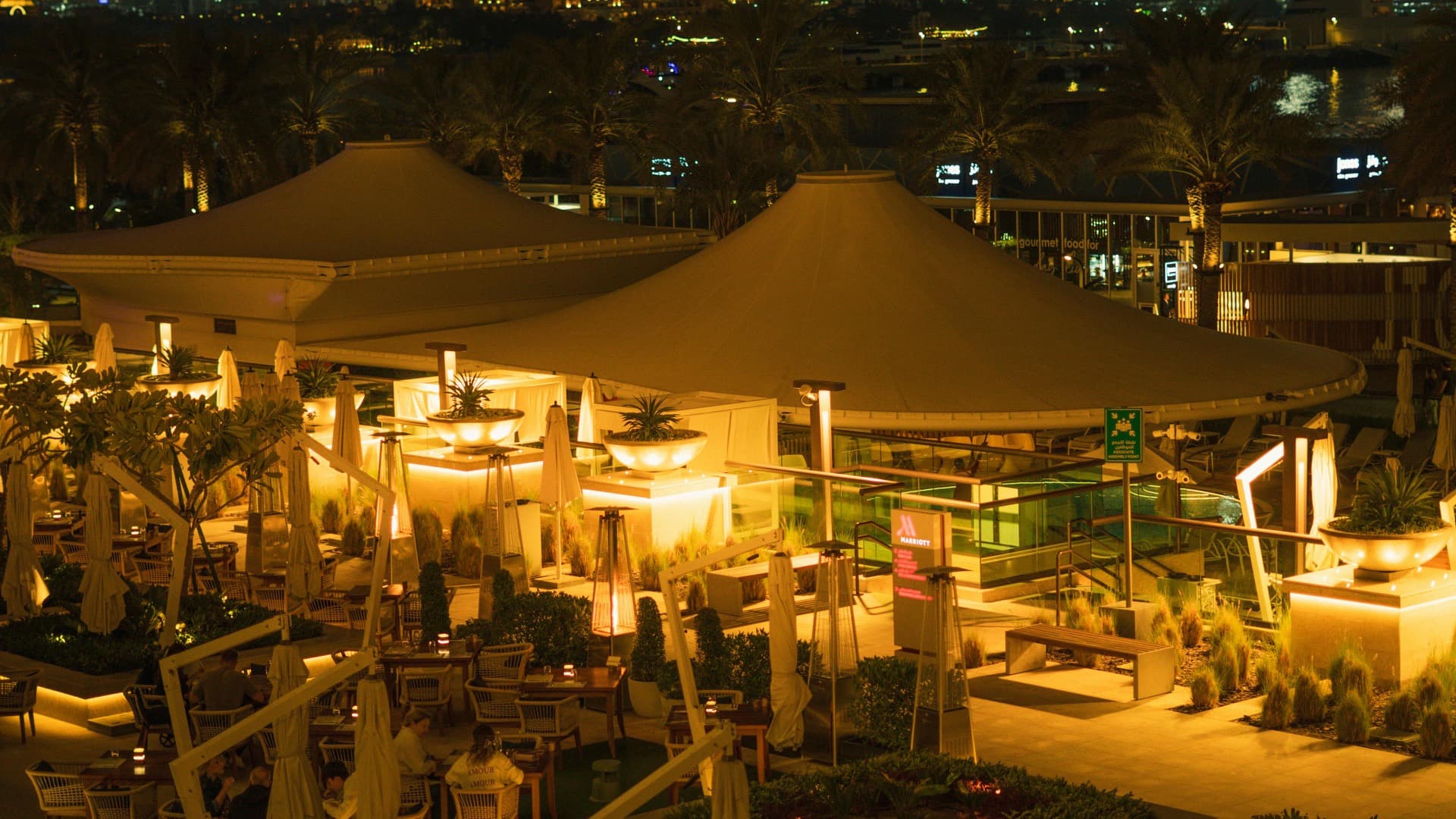Rooftop dinner overlooking the Accra skyline at night during the December season